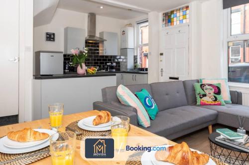a living room with a couch and a table with food at The Hyde Away Chic Urban Two Bedroom House By Movida Property Group Short Lets & Serviced Accommodation in Headingley