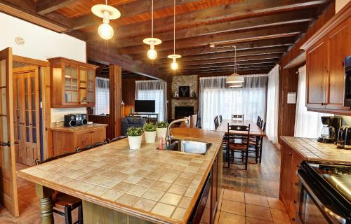 a kitchen with a sink and a counter top at Chalet 9006 Chemin des Alpages by Les Chalets Alpins in Stoneham