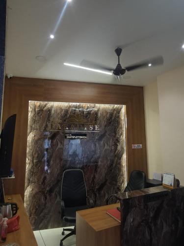 an office with a large painting on the wall at HOTEL PARADISE INN in Shinaya