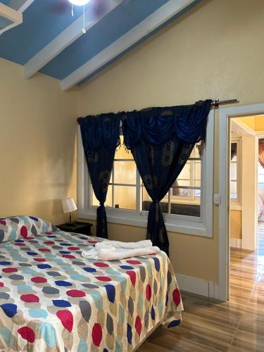 a bedroom with a bed and a window at Casa del Rio in Panajachel