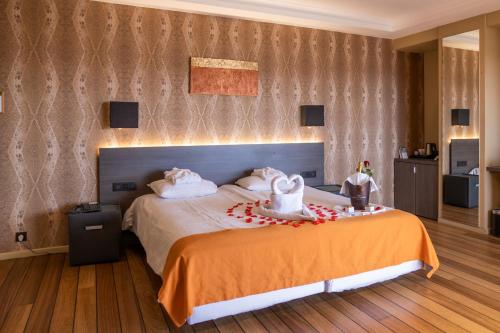 Postel nebo postele na pokoji v ubytování Hotel Donny