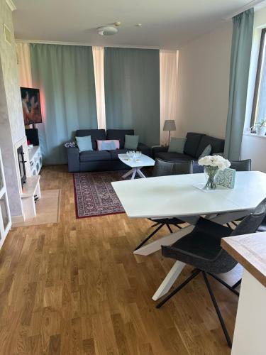 a living room with a couch and a table at Vacation house in Pravets golf resort At Pravets Lake in Pravets