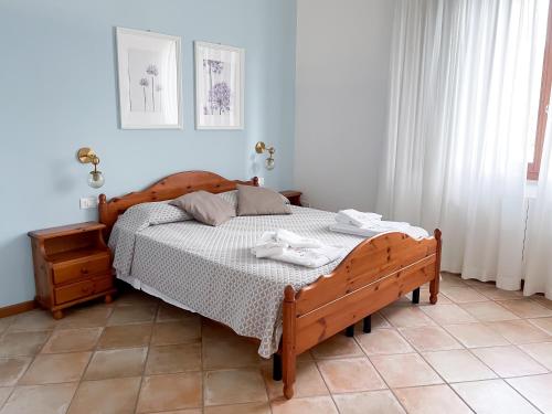 Ένα ή περισσότερα κρεβάτια σε δωμάτιο στο Agriturismo La Filanda