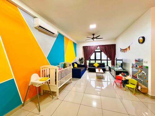 a nursery with colorful walls and a crib at Legoland-8min walk at Kairos Comfort Spacious Suite for Families 1-12pax in Nusajaya