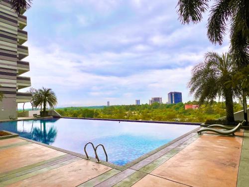 a swimming pool with a view of a city at Legoland-8min walk at Kairos Comfort Spacious Suite for Families 1-12pax in Nusajaya