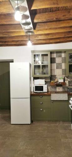 Η κουζίνα ή μικρή κουζίνα στο Jennas House