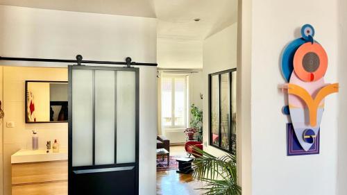 a hallway with a glass door in a house at Bright, spacious apartment in the heart of Lyon in Lyon