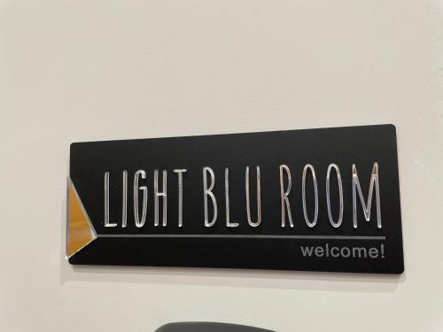 a sign for a light bulb room on a wall at Miambra in Grumo Nevano
