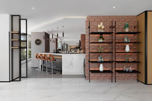 a kitchen with a brick wall and a counter at Four Points by Sheraton Boracay in Boracay