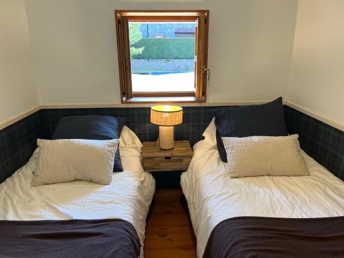 Postel nebo postele na pokoji v ubytování Casa adosada en Urús