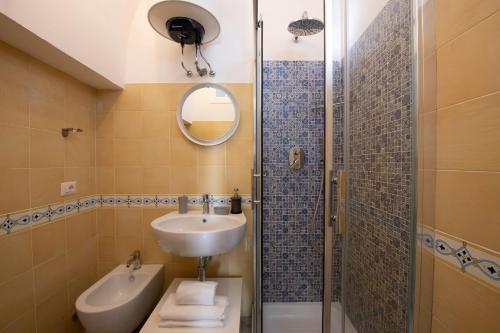 a bathroom with a sink and a shower at Sol Levante in Amalfi