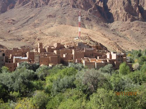 a village in the middle of a mountain at Kasbah Maison D’hôte Lalla Zahra in Aït Baha
