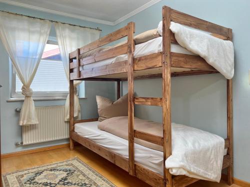 a bunk bed in a room with a window at Privathaus Sieglinde in Nußdorf