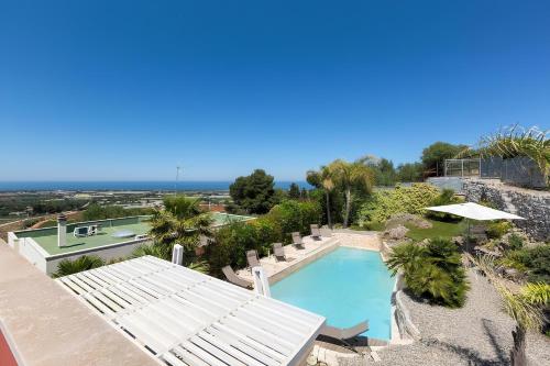 an overhead view of a swimming pool in a resort at Villa Iside in Conversano