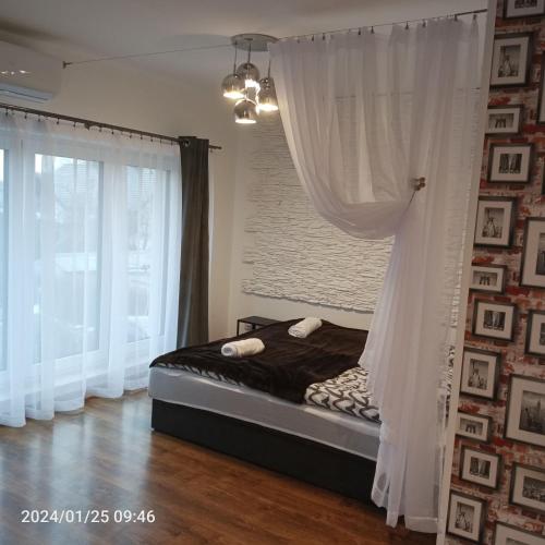 Postel nebo postele na pokoji v ubytování Apartamenty Jagiełło