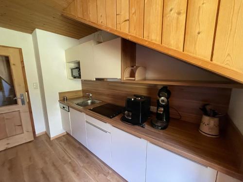 a kitchen with a sink and a counter top at Apart Sonnenheim in Kaunertal