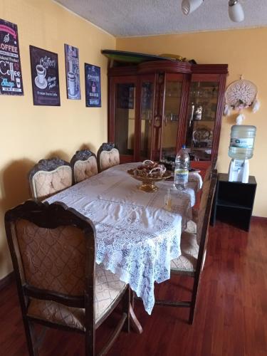 a dining room with a table with chairs and a dining room at Dpto Empart 5 in Arica