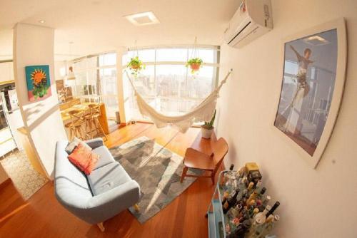 a living room with a couch and a table at Vem pro Copan in Sao Paulo