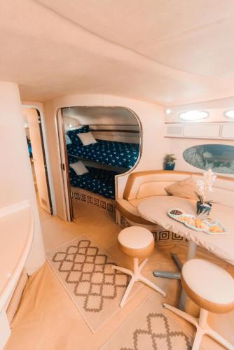 an interior view of a rv with a table and chairs at Ocean Blue in Cancún