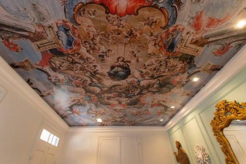 a painting on the ceiling of a room at Casa Fé - Caminhos de Ouro Preto in Ouro Preto