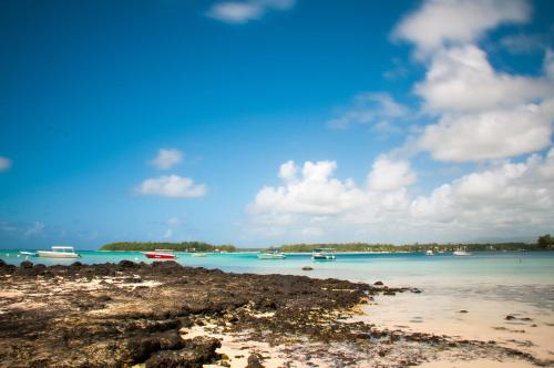 a view of a beach with boats in the water at Chantauvent Guest House in Blue Bay