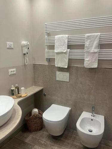 a bathroom with a white toilet and a sink at Hotel Il colle di Monterosso in Monterosso al Mare