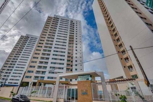 a tall building with two tall buildings at Apartamento Charme Benfica in Fortaleza