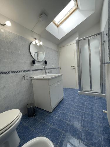 a bathroom with a toilet and a sink at Casa Giorgio in Fano
