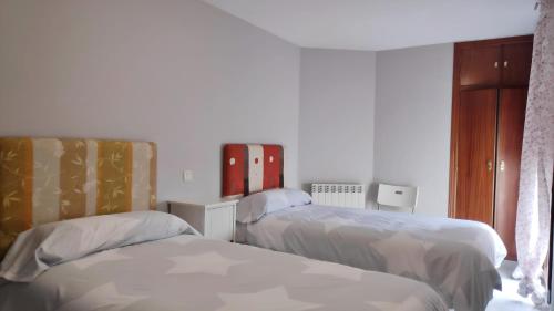 Postel nebo postele na pokoji v ubytování Apartamentos GO - Tordesillas House