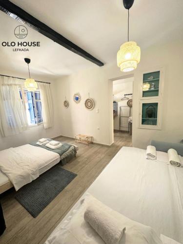 Кровать или кровати в номере OLO House Lefkada