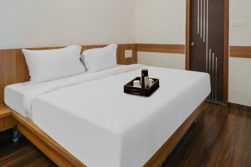 Tempat tidur dalam kamar di Townhouse 864 Atharva