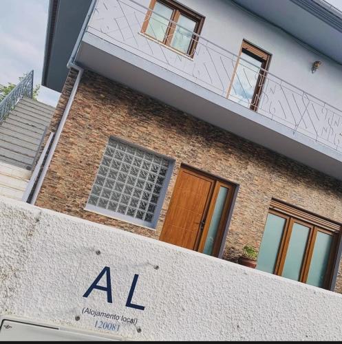 a building with a ak sign in front of it at Anjú-Pardal in Mogadouro