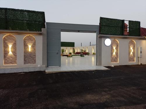 a house with a patio with lights on it at شاليه My rest in Muhayil