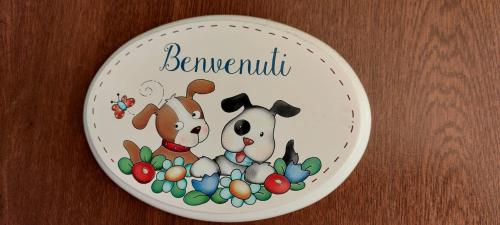 a plate with two dogs and eggs on it at Bed And Breakfast A CASA DI LEO in Tarquinia