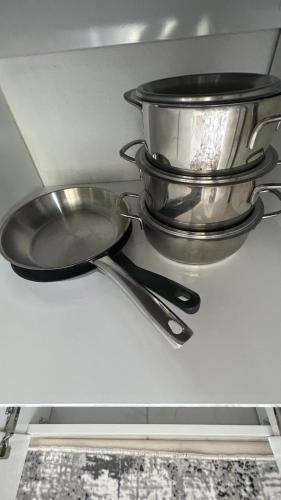 a pan and two pans sitting on a shelf at Backyard Apart in Kemer
