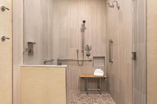 a bathroom with a shower and a sink at Zachari Dunes on Mandalay Beach, Curio Collection by Hilton in Oxnard