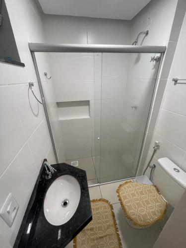 a bathroom with a sink and a shower at Premier do Atalaia M203 in Salinópolis