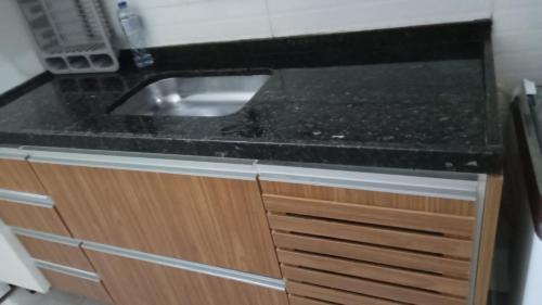 Η κουζίνα ή μικρή κουζίνα στο Apartamento a poucos metros do mar em Guarapari