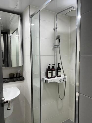 a bathroom with a shower and a sink at 호야스테이 Hoya stay in Yeosu