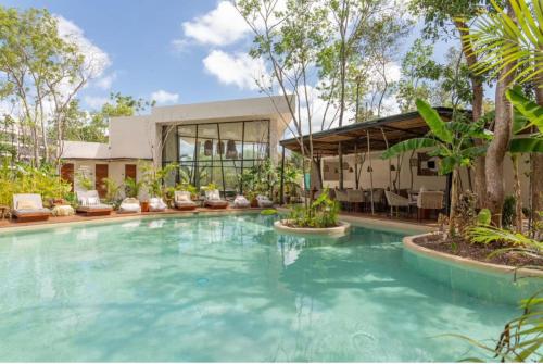 a large swimming pool in front of a building at JADE ZEN RESIDENCES - (35) in Tulum