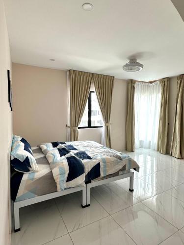 a bedroom with a bed and a large window at Peak Homestay@Ipoh Perak Malaysia 10-14Pax 5R/6B in Lahat