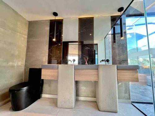 a kitchen with a counter with a sink at penthouse luxurytravelhome poblado in Medellín
