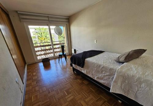 En eller flere senge i et værelse på Mejor ubicación de Viña del Mar