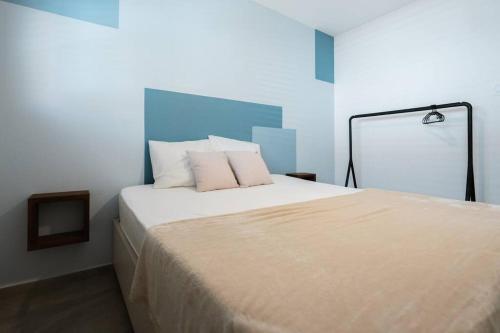 a bedroom with a large bed with two pillows at VILLA Arte - just minutes from Mambo & Pietermaai in Willemstad