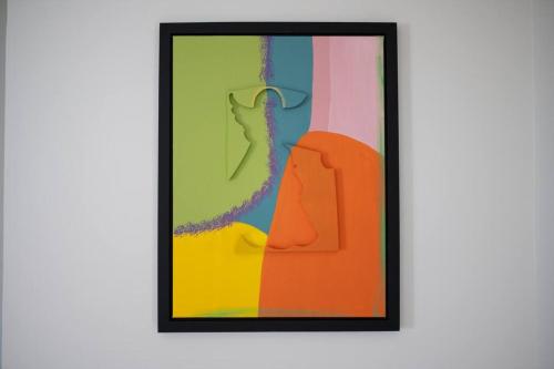 a framed picture of a painting on a wall at VILLA Arte - just minutes from Mambo & Pietermaai in Willemstad