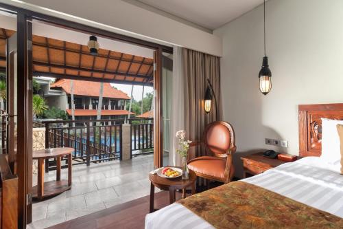 Un pat sau paturi într-o cameră la Best Western Premier Agung Resort Ubud