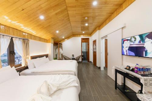 TV a/nebo společenská místnost v ubytování Olagi Hotel 2