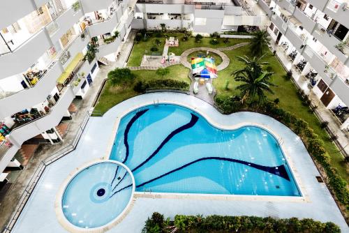 an overhead view of a swimming pool in an apartment building at The Eastern, by Meixi in Jelutong