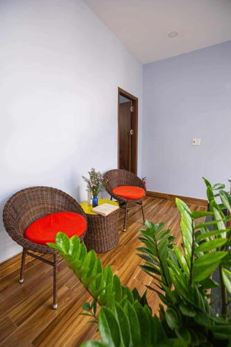 two chairs and a table in a living room at Leila House - DaNang Central - 3BRs - Free Airport Shuttle in Da Nang