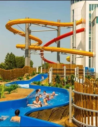 a group of people in a water slide at a water park at Cosy caravans 10 berth caravan on Butlins Skegness in Skegness